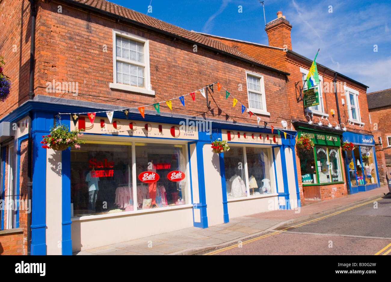 high street uk Row of local shops in village of Edwinstowe Nottinghamshire England UK EU Stock Photo