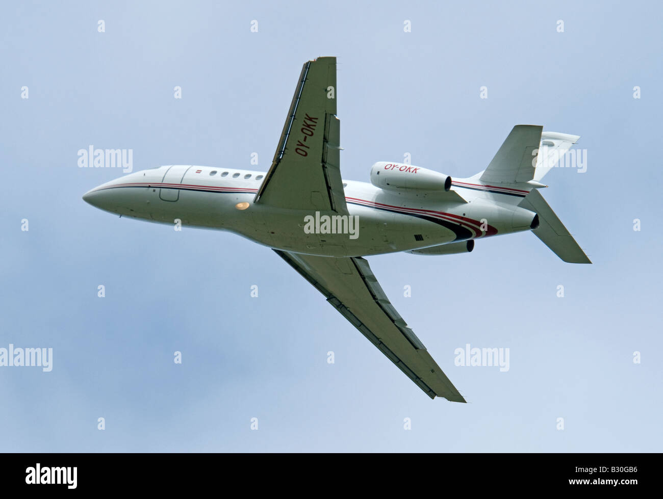 Dassault Falcon 900EX owned by the Danish Lego company leaving Inverness Airfield Stock Photo