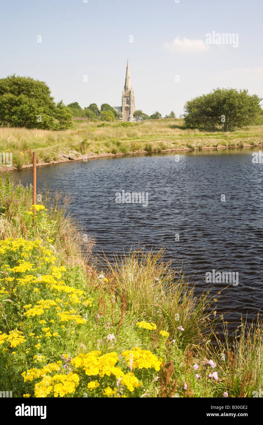 St Peters church Belmont from Wards reservoir known locally as the Blue Lagoon Lancashire Stock Photo