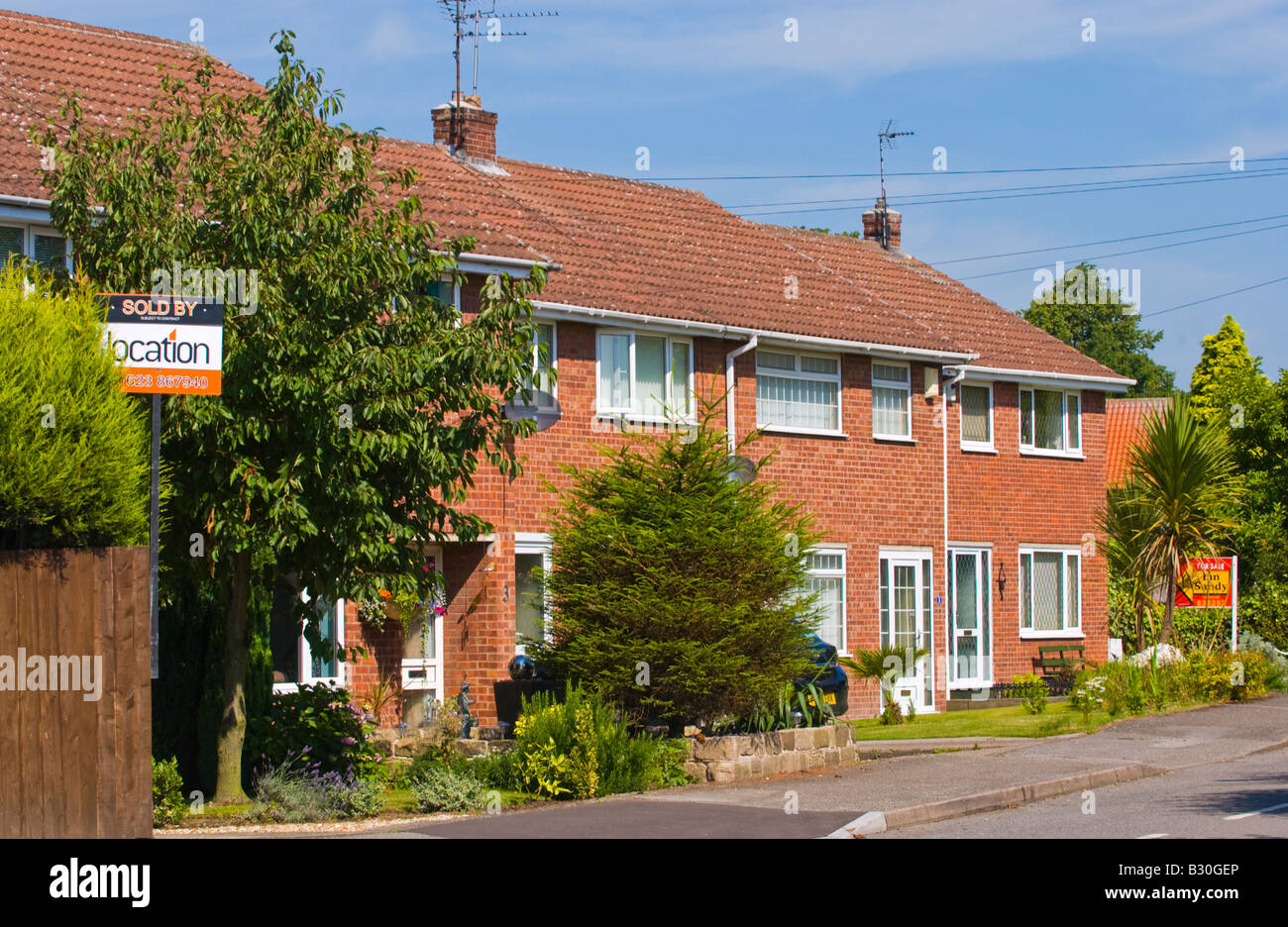 Sold and for sale signs outside houses in village of Edwinstowe