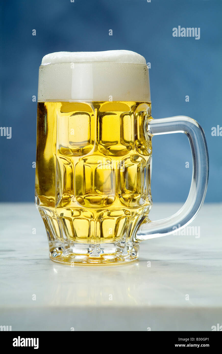 A beer jug on blue background Stock Photo