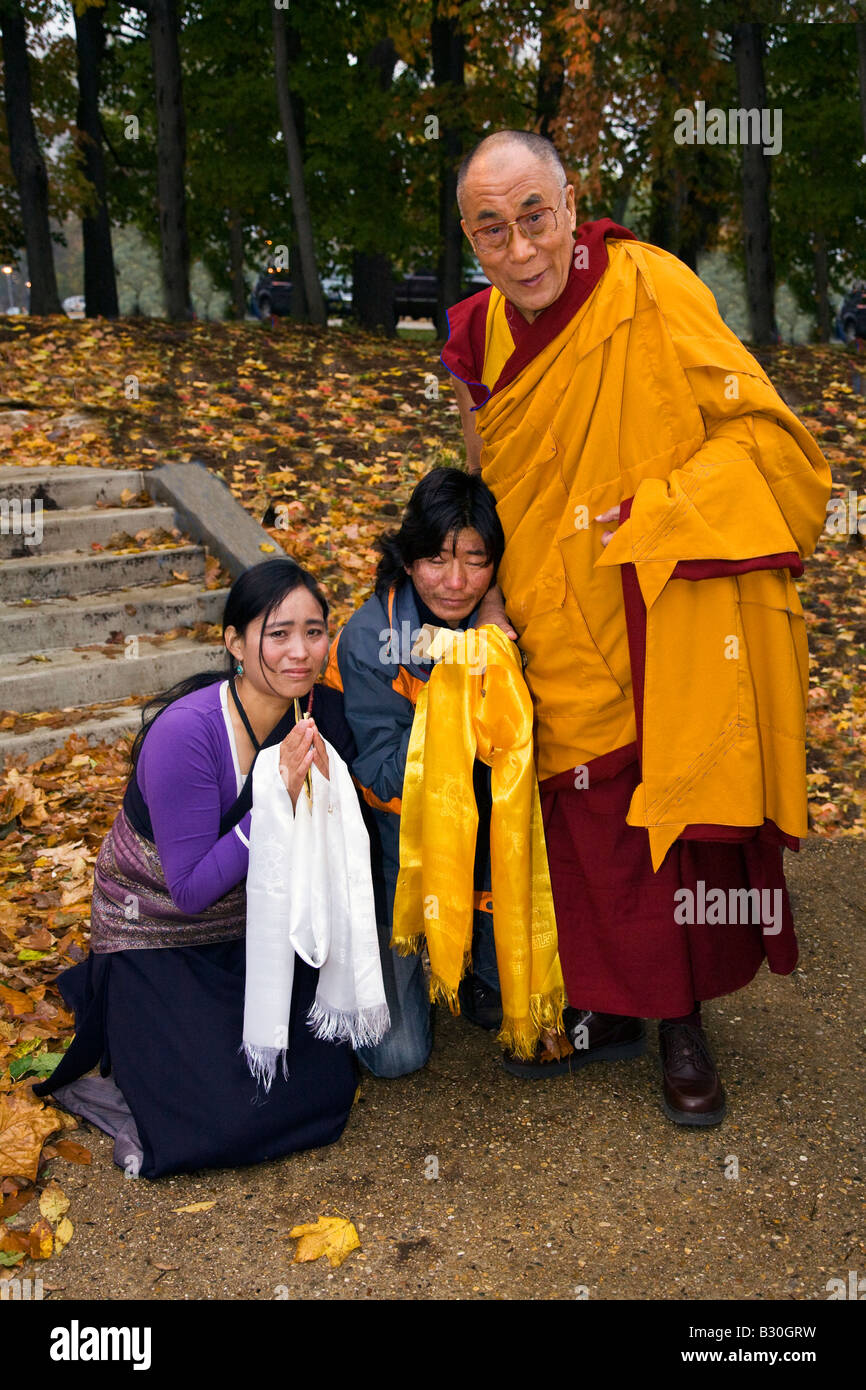 The 14th DALAI LAMA with weeping Tibetan refugees BLOOMINGTON INDIANA Stock Photo