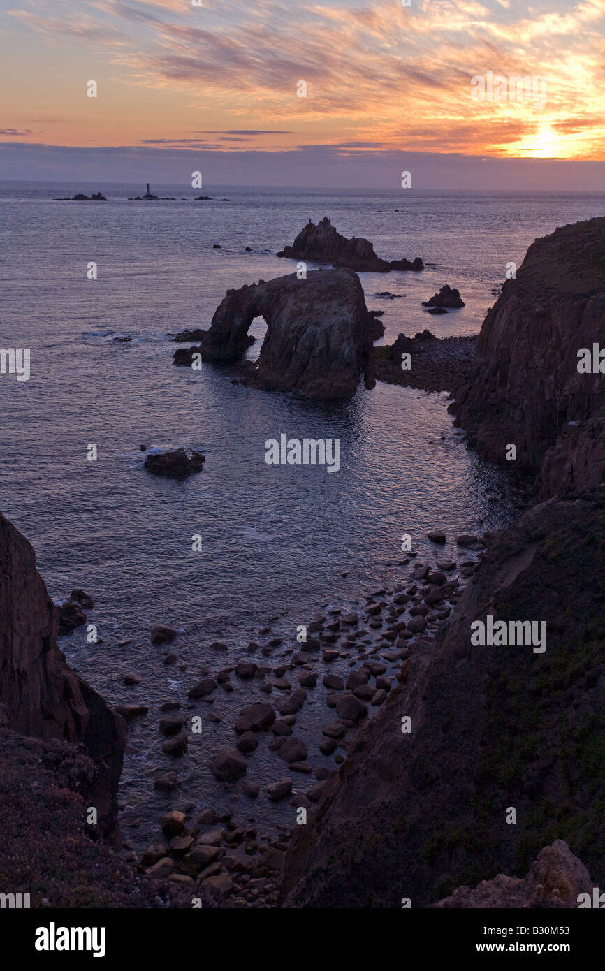 Lands End rocks looking to Longships Lighthouse evening summer sunset