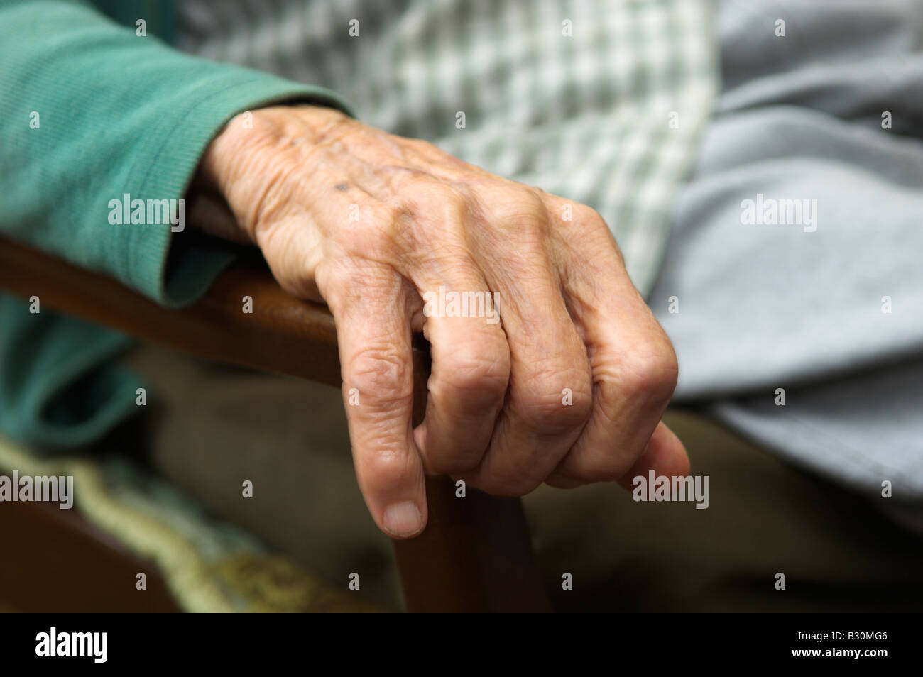 Closeup of hand on chair armrest 92 year old elderly woman Stock Photo