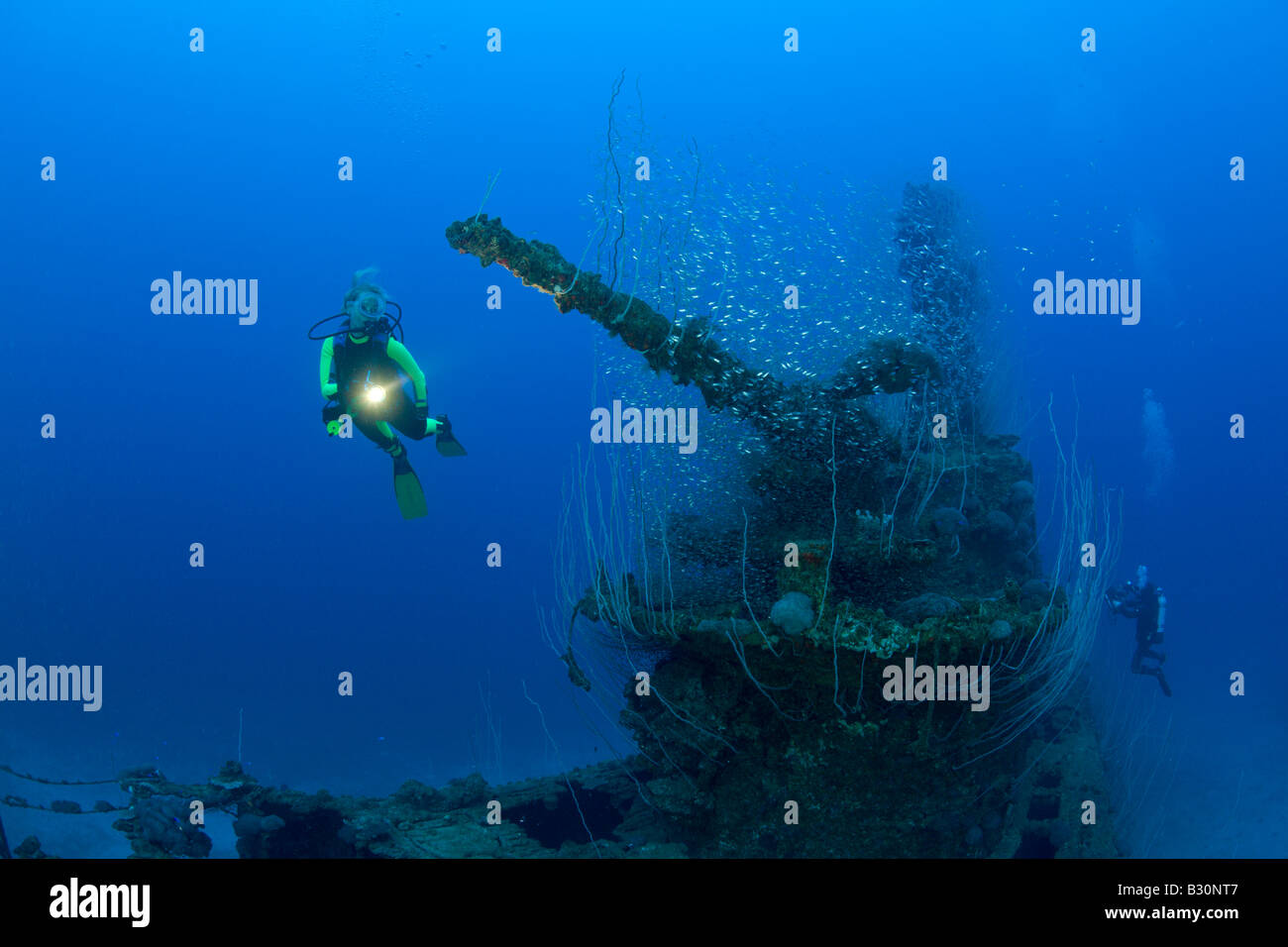 Diver and 5 inch Deck Gun of USS Apogon Submarine Marshall Islands Bikini Atoll Micronesia Pacific Ocean Stock Photo