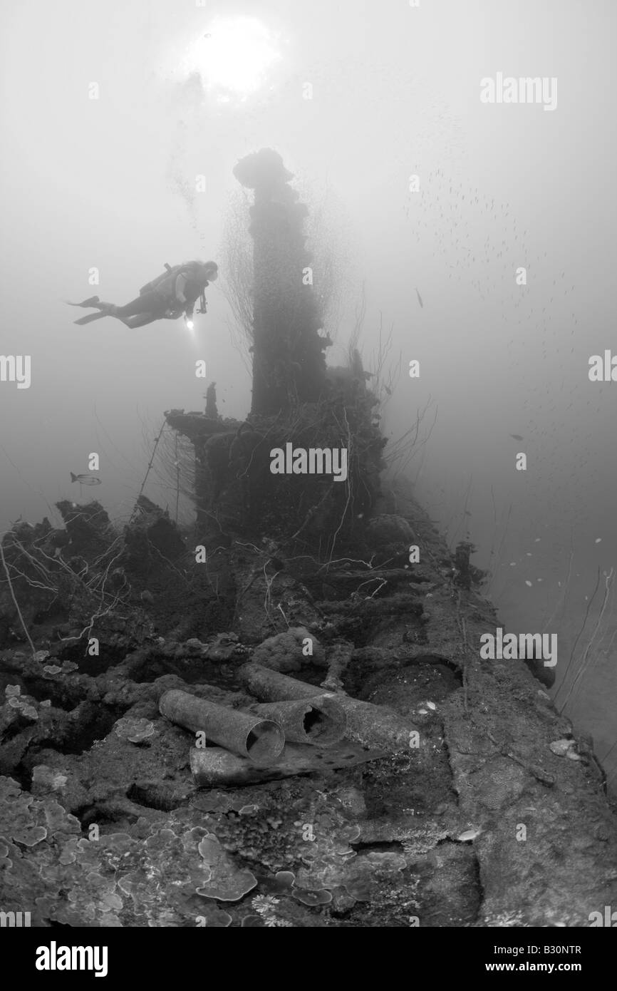 Diver and Munition under Tower of USS Apogon Submarine Marshall Islands Bikini Atoll Micronesia Pacific Ocean Stock Photo