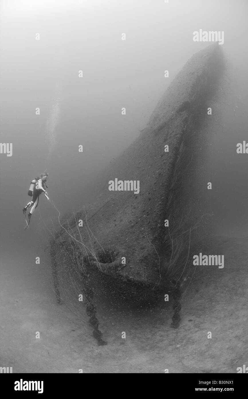 Diver at Bow of USS Arkansas Battleship Marshall Islands Bikini Atoll Micronesia Pacific Ocean Stock Photo