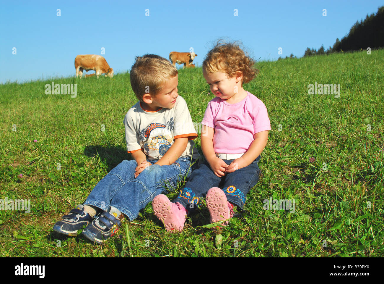 children in the meadow Stock Photo