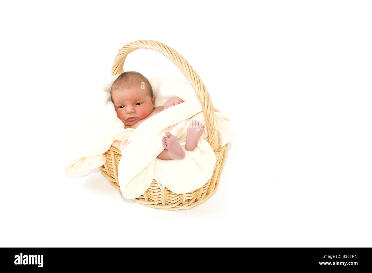 Baby in basket Stock Photo