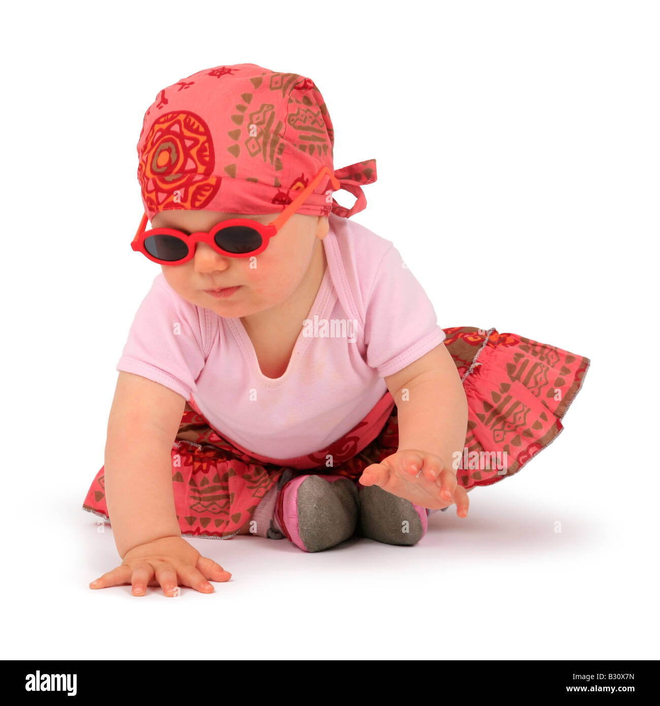 baby with sunglasses crawling Stock Photo