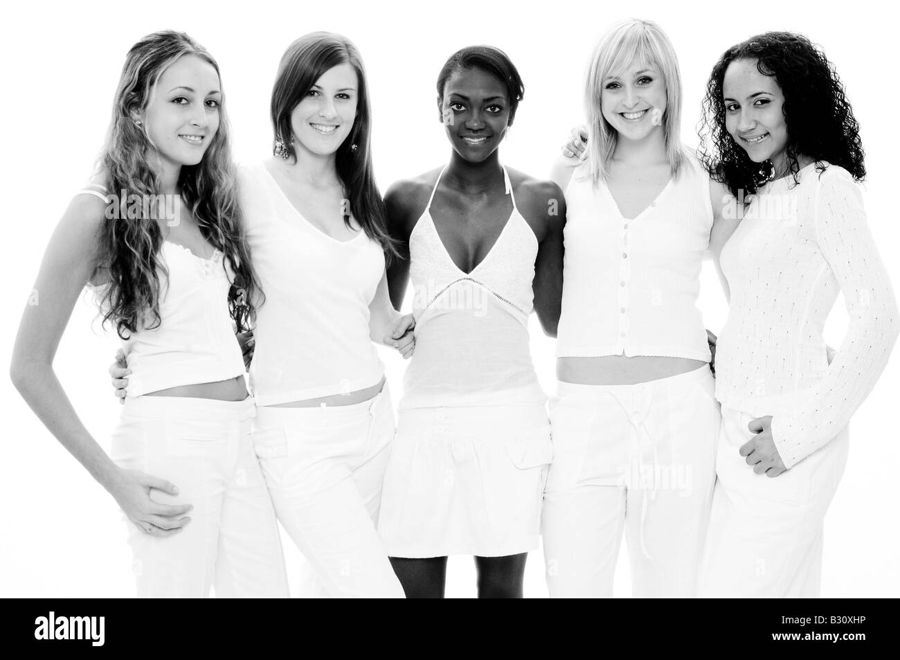 A group of five beautiful women in white on white Stock Photo