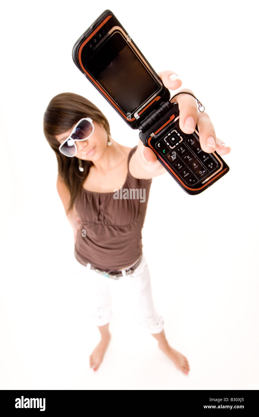 A funky girl holds up her phone Stock Photo