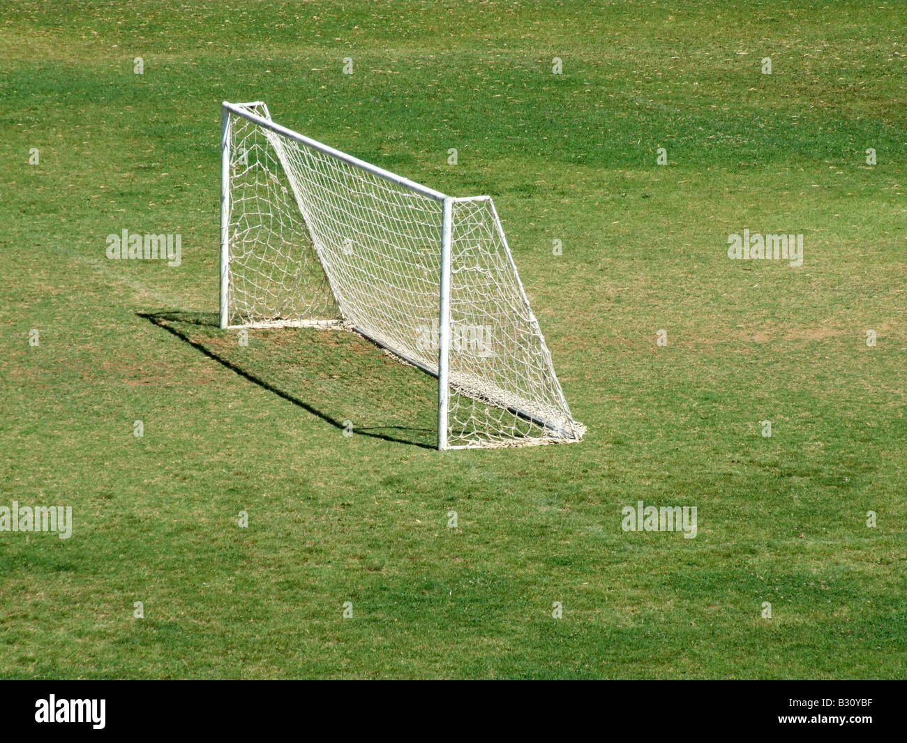 detail of football goal posts in green field in sun Stock Photo Alamy