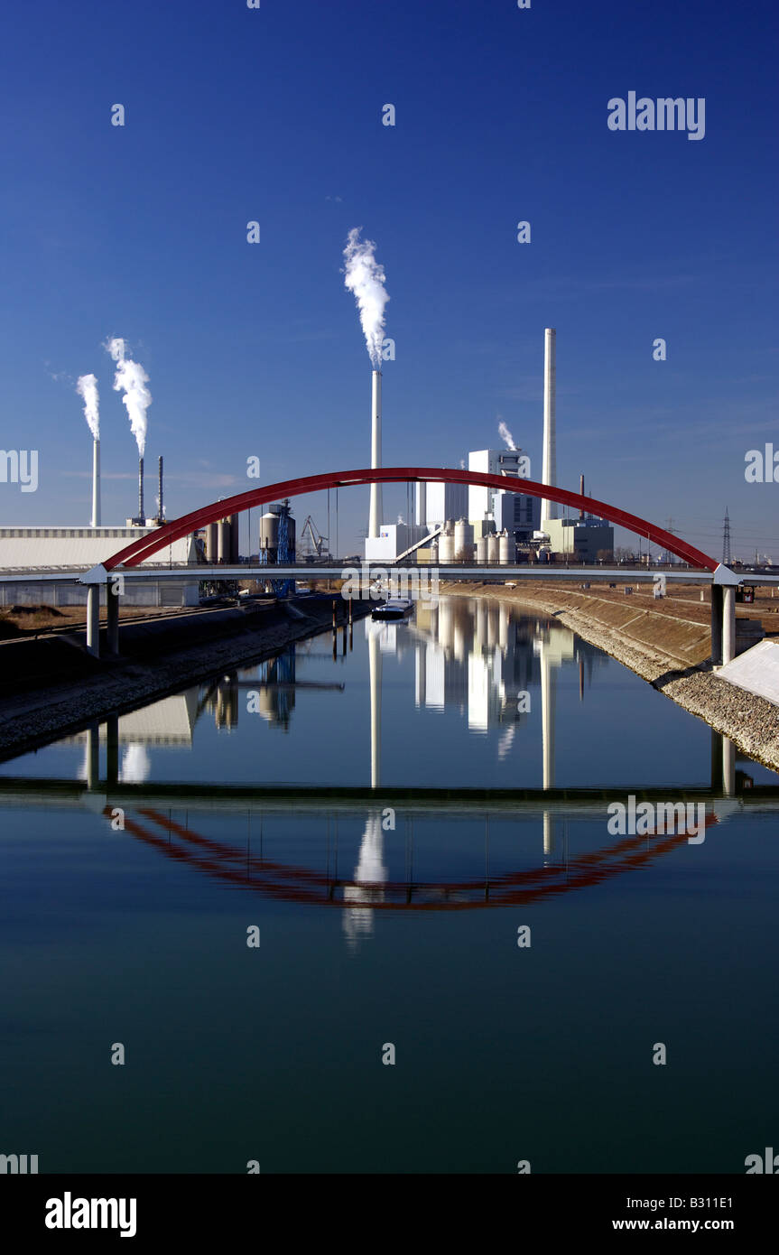 electric power station in Mannheim Germany with bridge over an arm of the River Rhine Stock Photo