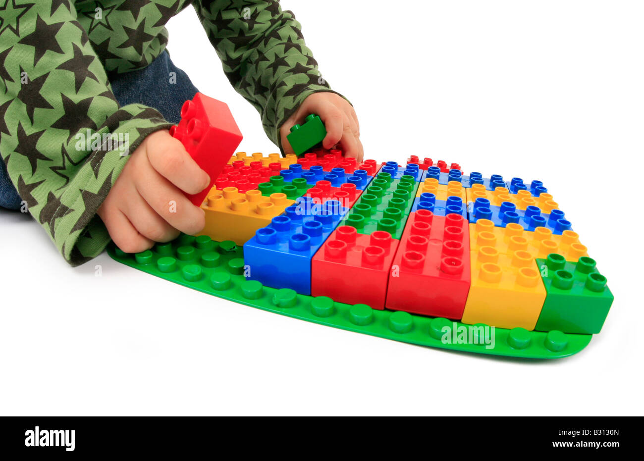 little boy playing with Lego bricks Stock Photo