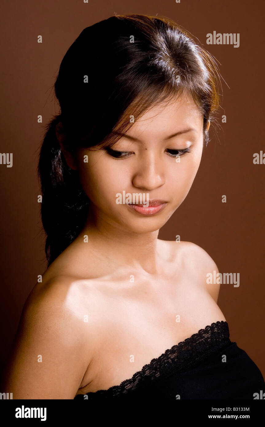 Shy demure young woman hi-res stock photography and images - Alamy