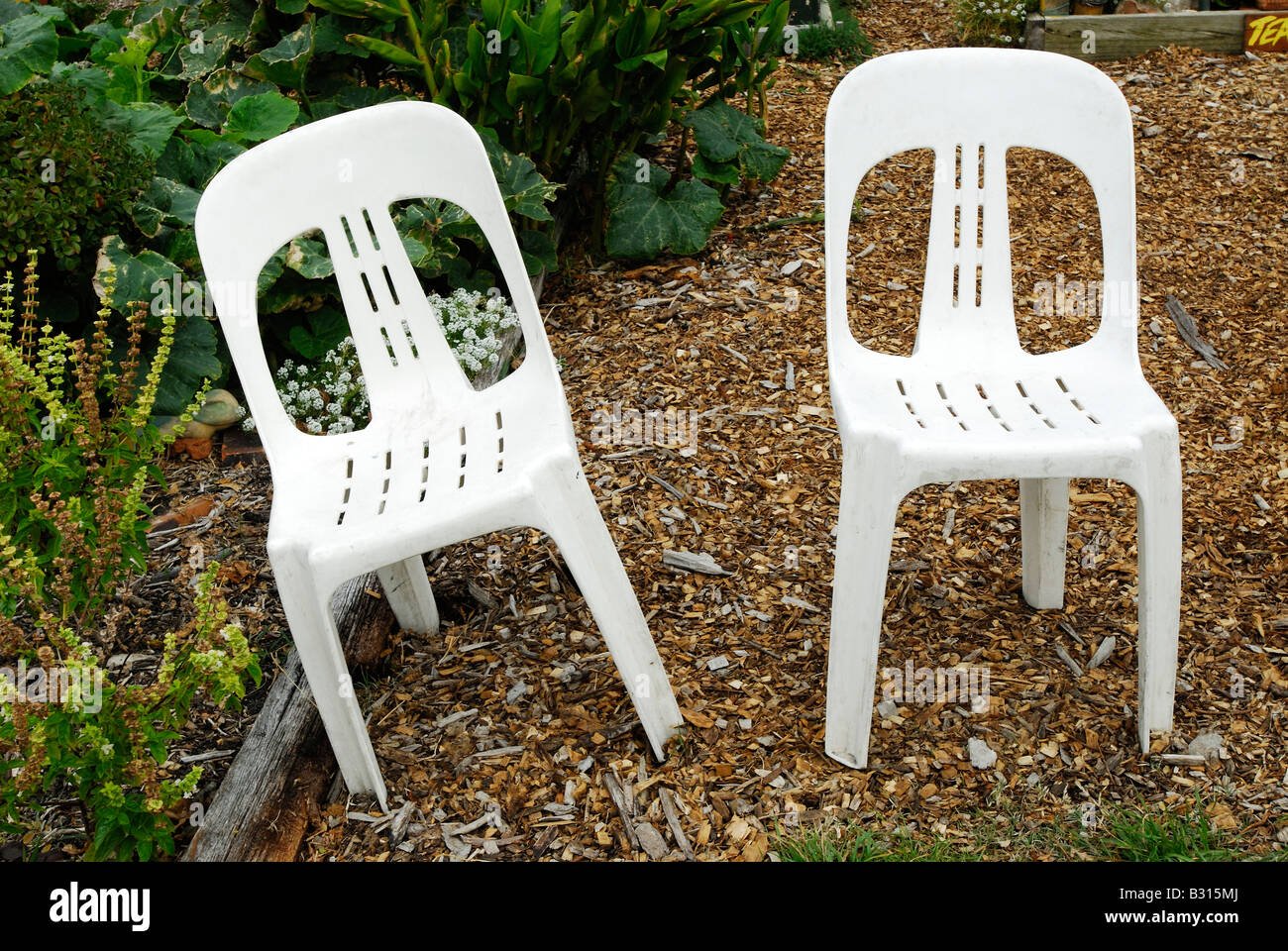 Two white plastic chairs Stock Photo Alamy