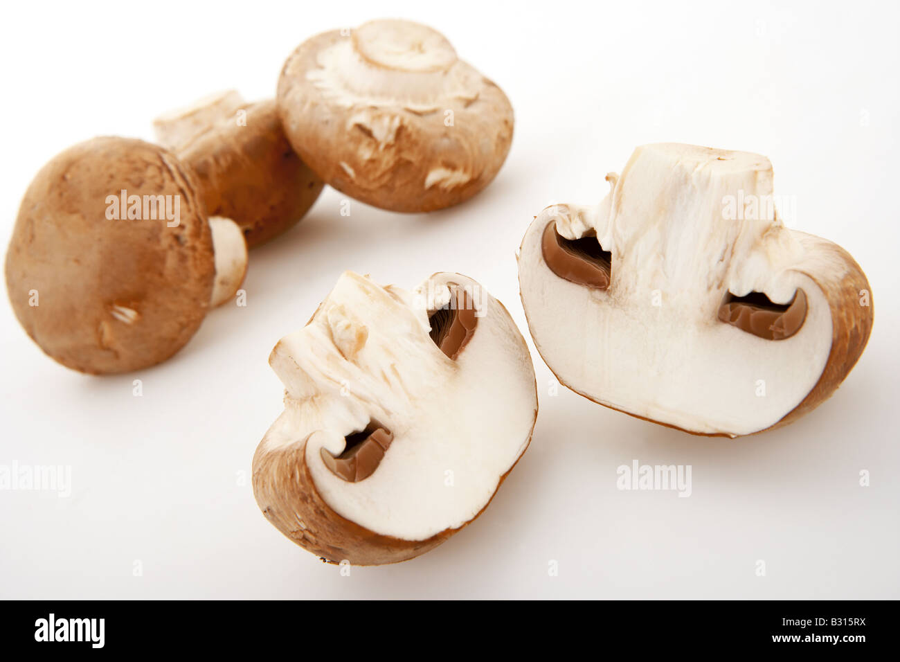 Fresh mushrooms sliced and arranged on a white background Stock Photo