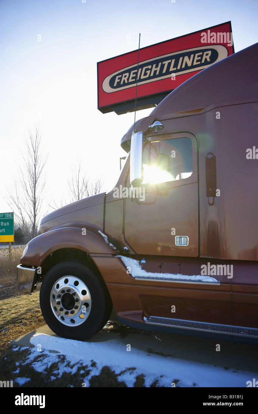 Side view of truck parked at truck stop Stock Photo