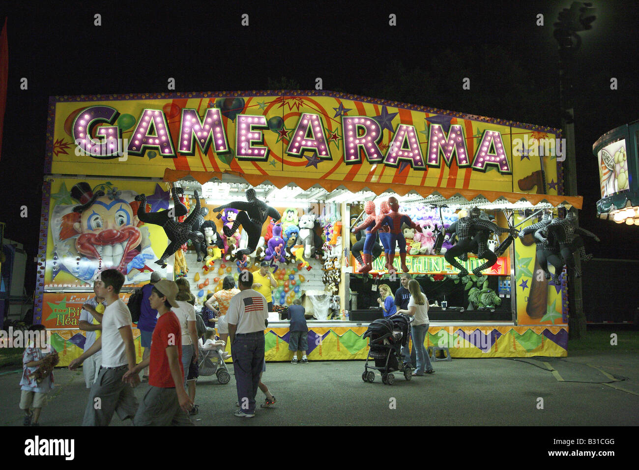 Game a rama Funfair gallery. Game stall festooned with giant stuffed animals Stock Photo