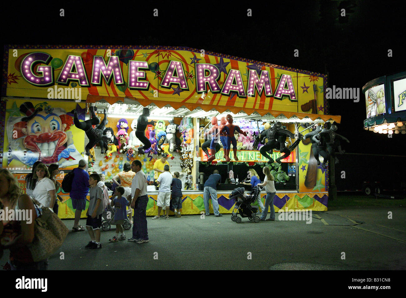 Game a rama Funfair gallery. Game stall festooned with giant stuffed animals Stock Photo