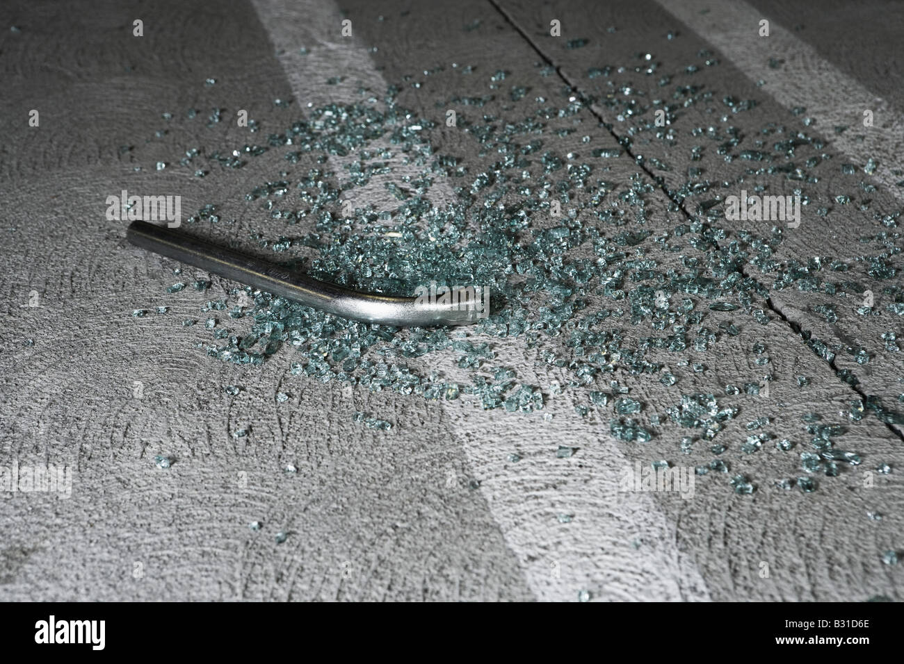 Crowbar and broken glass in car park Stock Photo - Alamy