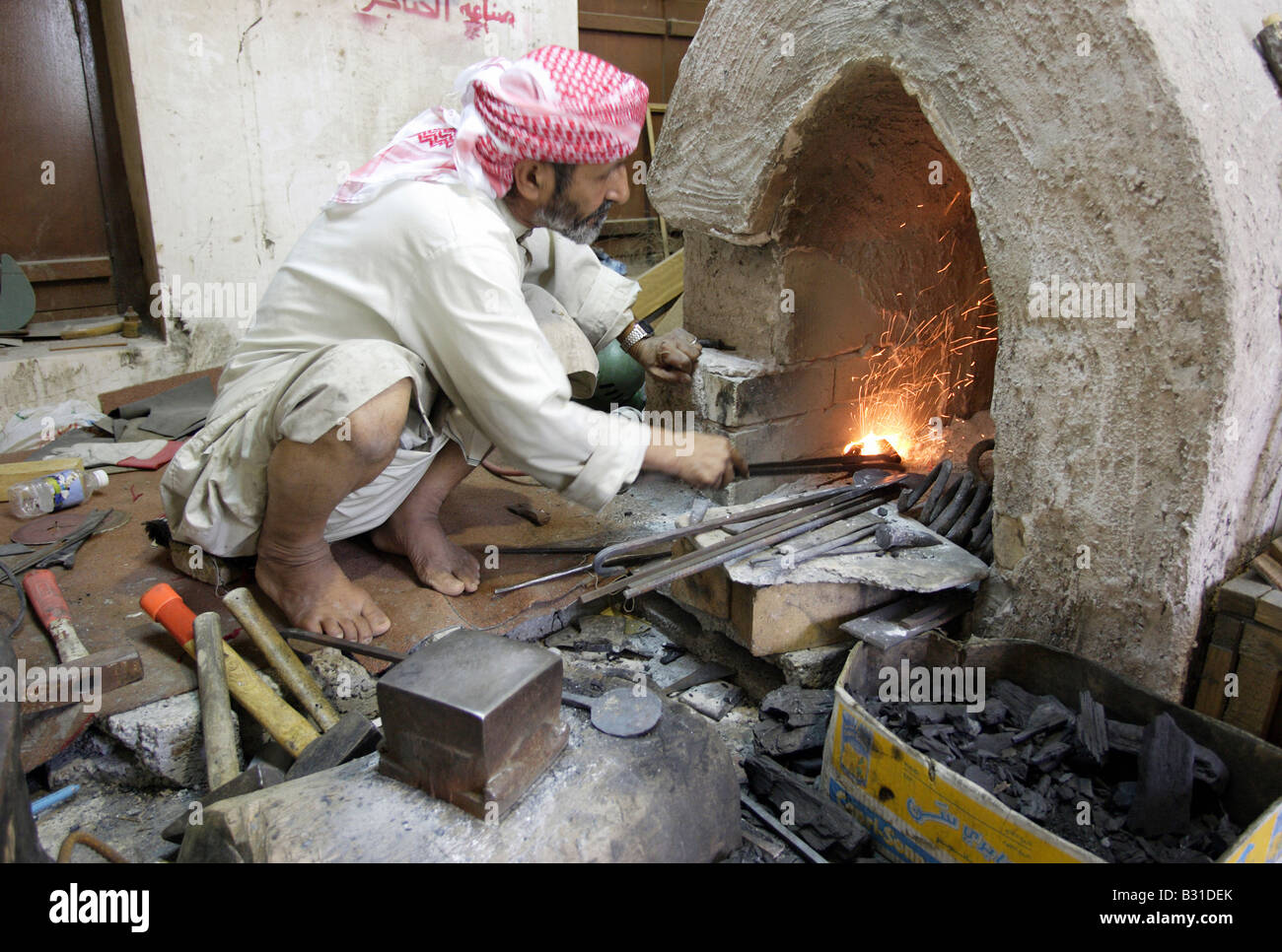 Blacksmith at work, Abu Dhabi, United Arab Emiarates Stock Photo Alamy