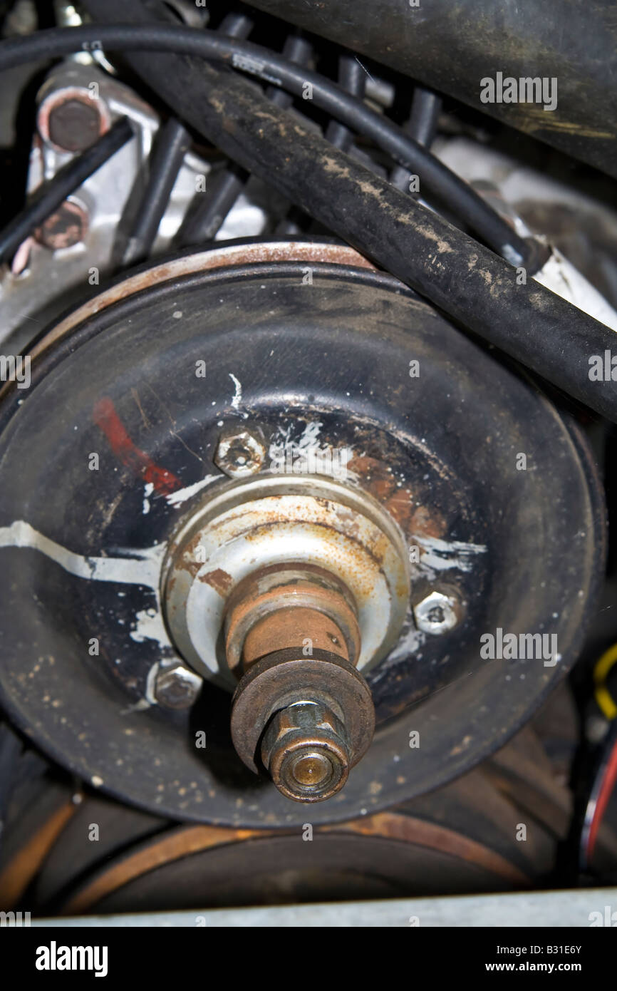 Close up crank shaft pulley auto car engine motor part uk hires stock