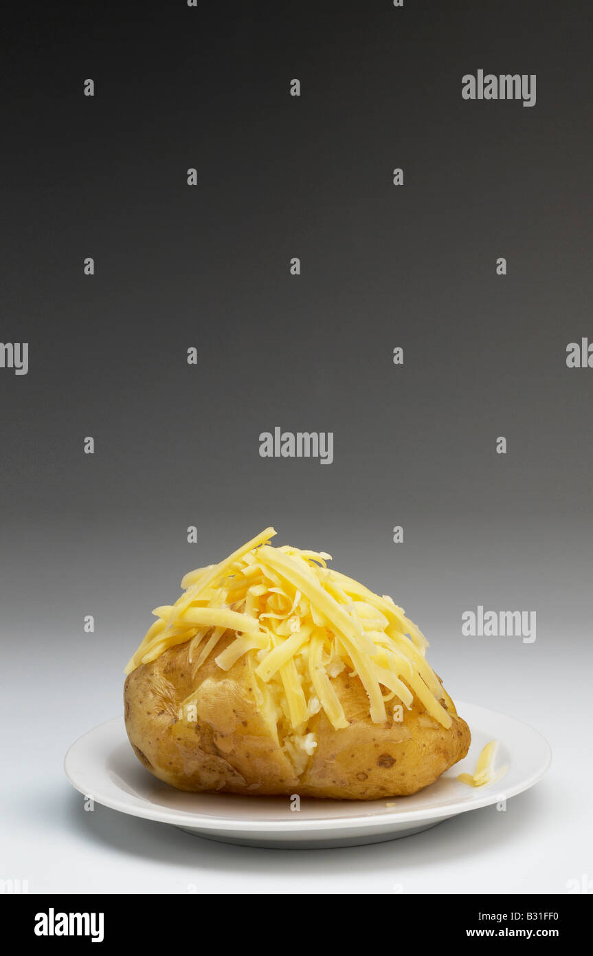 Baked potato with cheddar cheese Stock Photo - Alamy