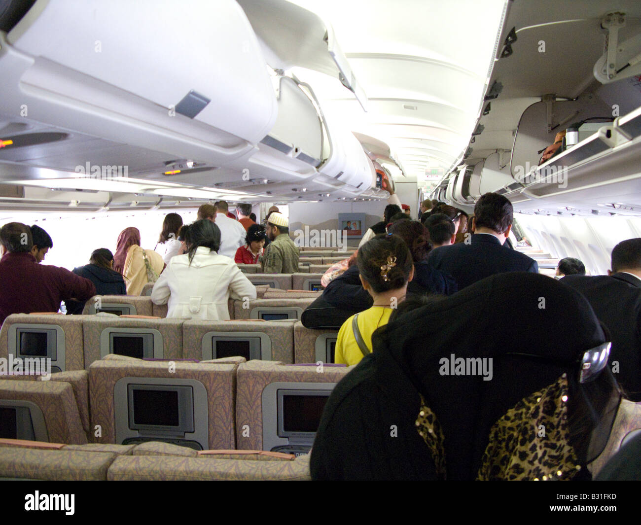 Passengers queue to leave their Airbus plane Stock Photo