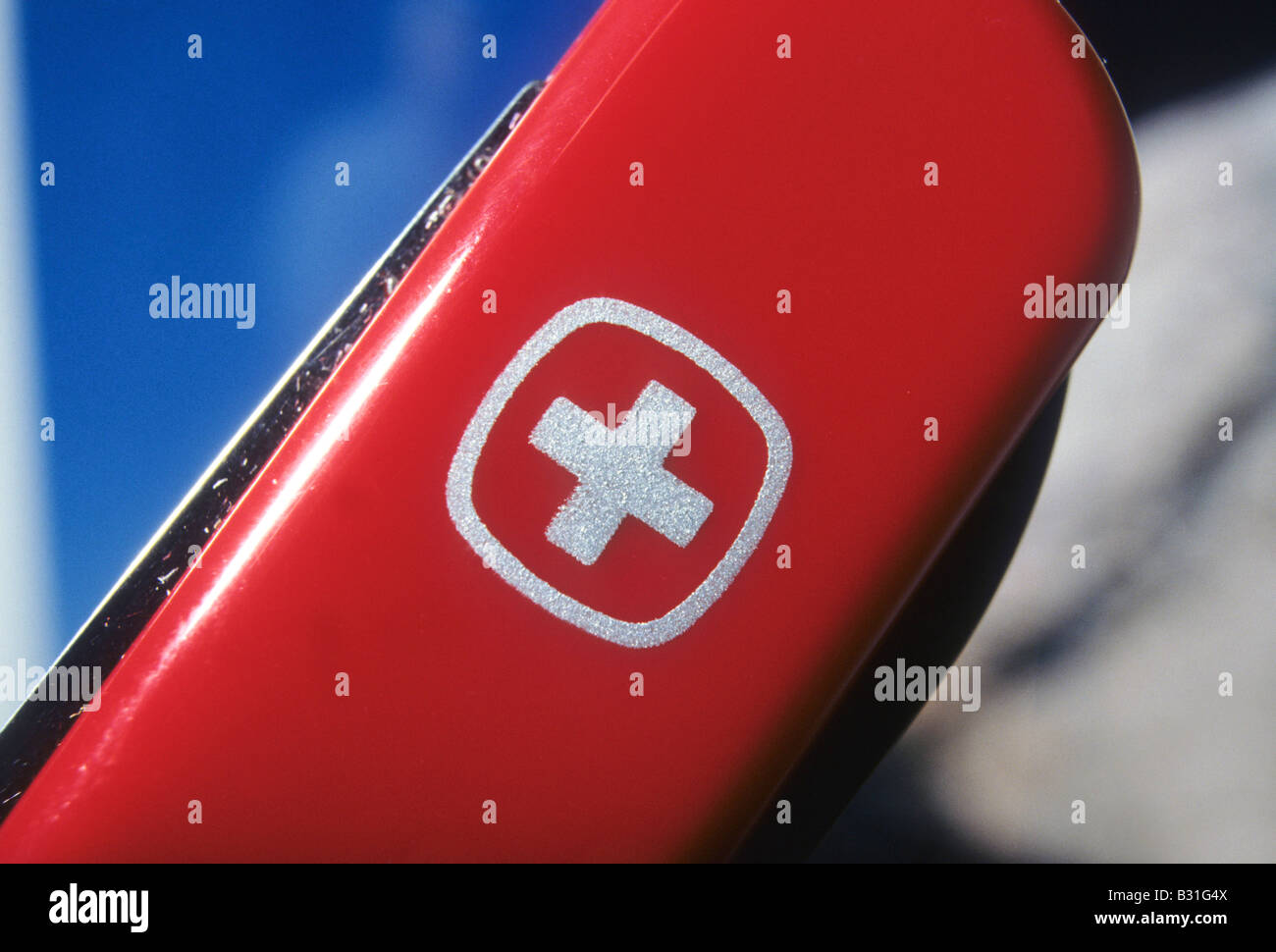 Victorinox logo on side of bright red Swiss army knife. Stock Photo