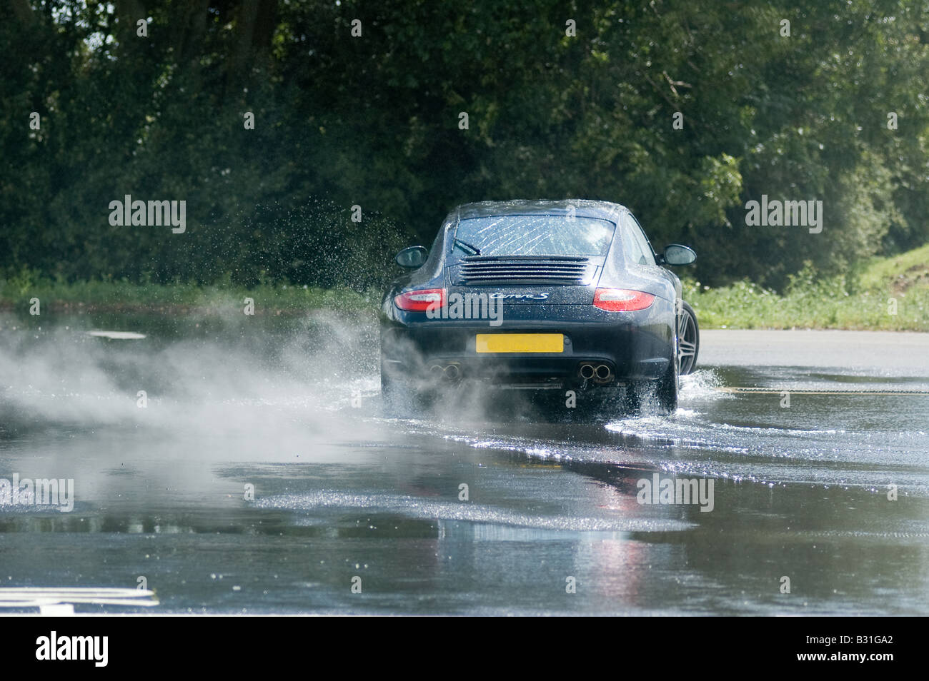 Porsche CARRERA ON SKID PAN Stock Photo