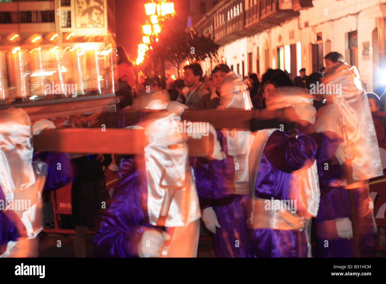 A group of masked men carrying a sacred image during a catholic procession, Tunja, Boyacá, Colombia, South America Stock Photo