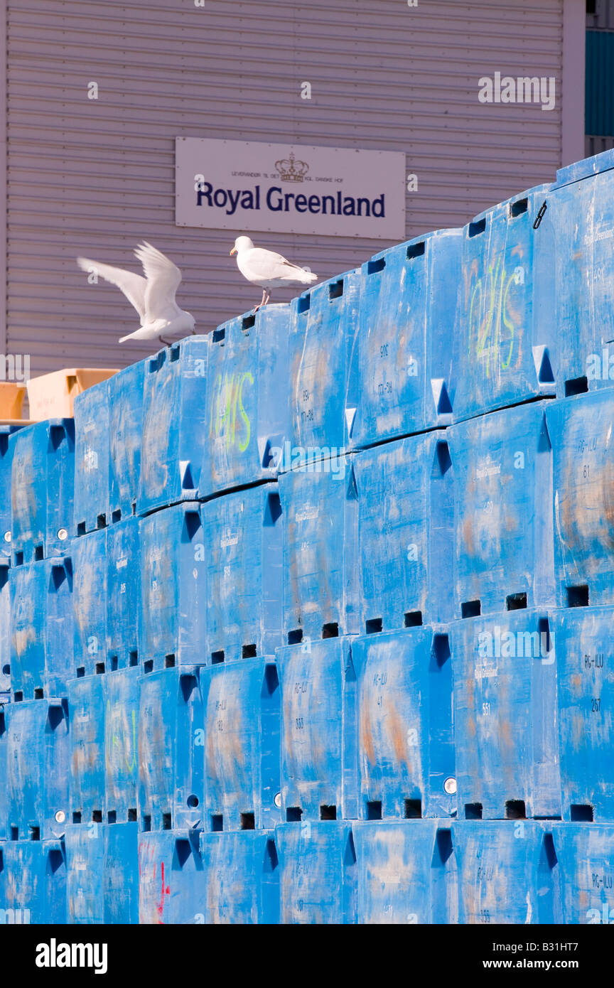 Plastic fish containers on the quayside at Ilulissat in Greenland Stock