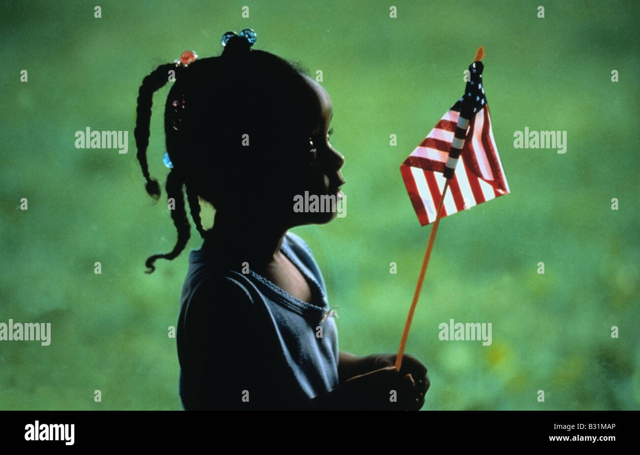 Young African American girl holding American flag Stock Photo - Alamy
