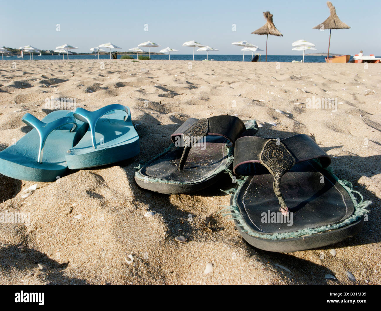 Flip-flops on the beach Stock Photo - Alamy