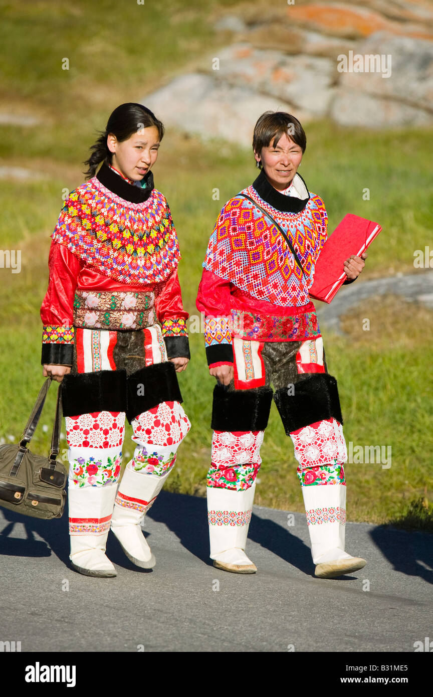 Inuit women wearing traditional Greenlandic national costume or Kalaallisuut in Ilulissat on Greenland Stock Photo