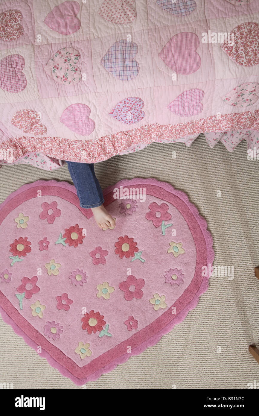 young girl under bed Stock Photo Alamy
