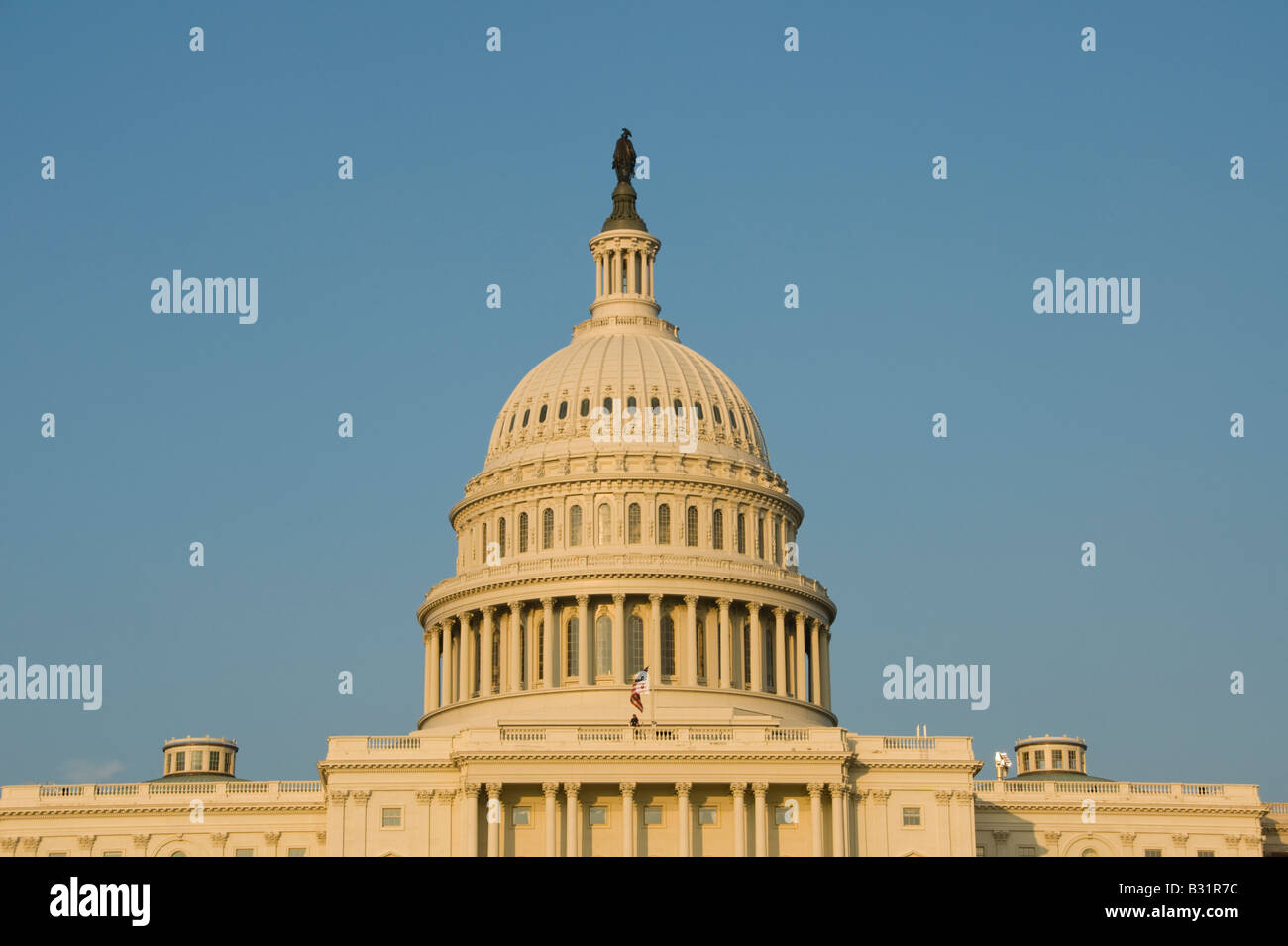 The dome of the US Capitol Building, legislative branch of the US government, seen in golden afternoon light, in Washington, DC. Stock Photo