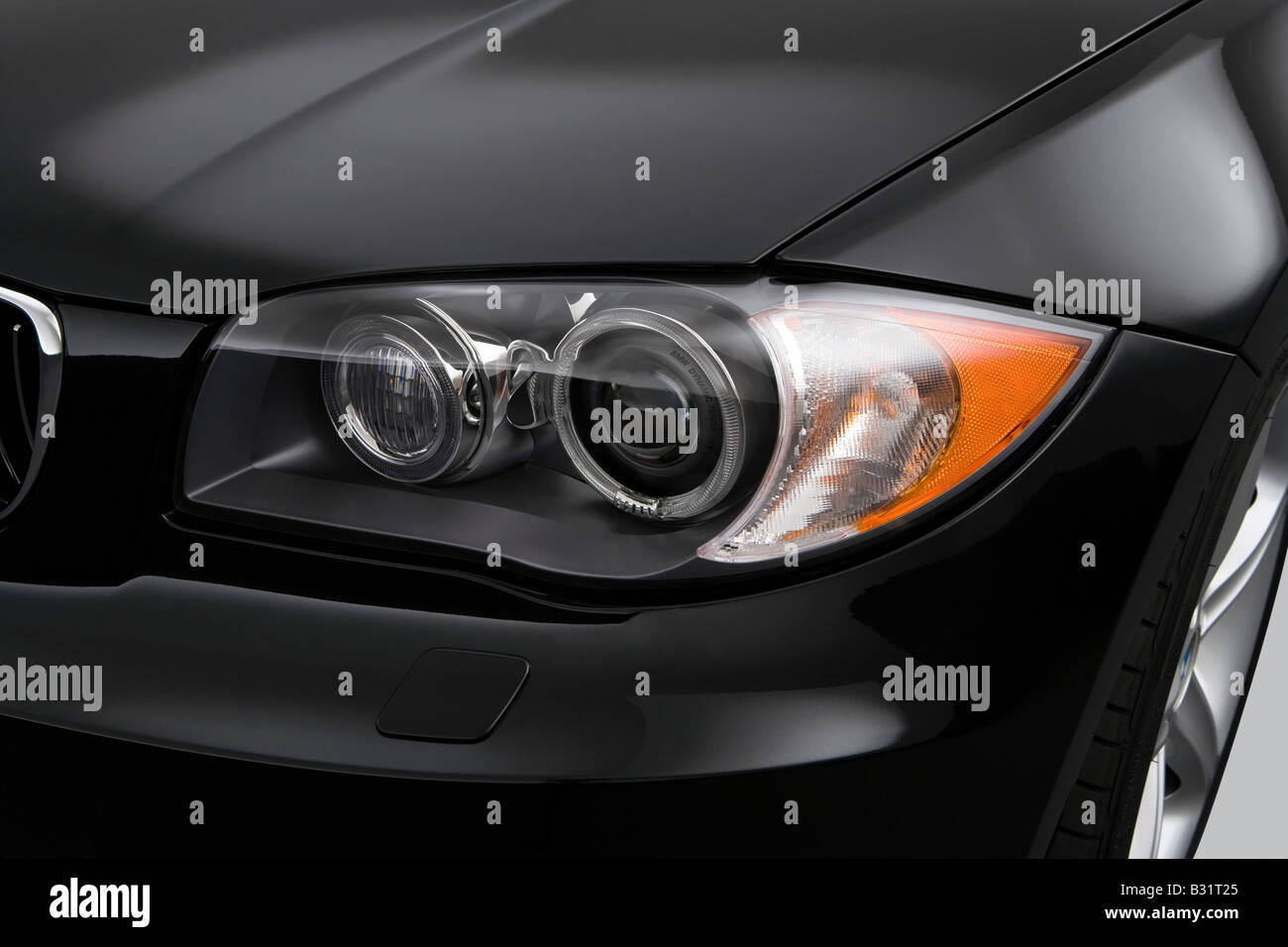 2008 BMW 1-series 135i in Black - Headlight Stock Photo - Alamy