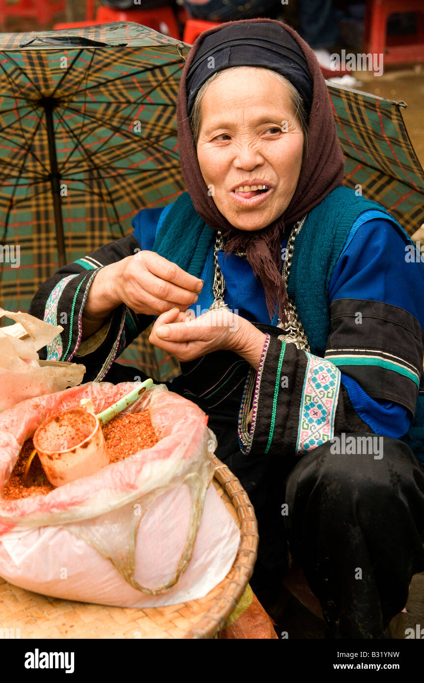 A black Hmong women smiling in a market North Vietnam Stock Photo