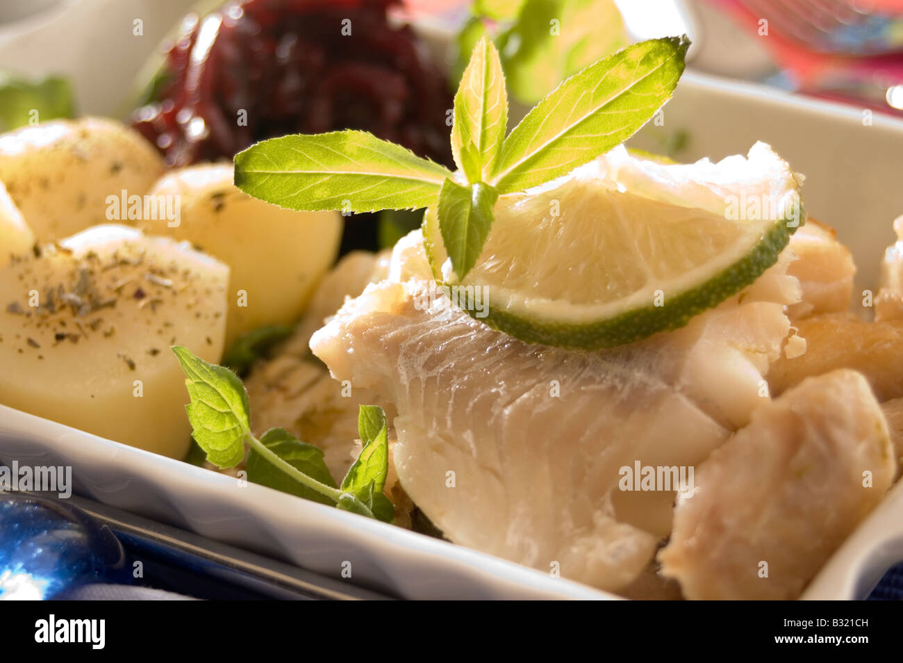 Cooked halibut fish served with potatoes Stock Photo Alamy