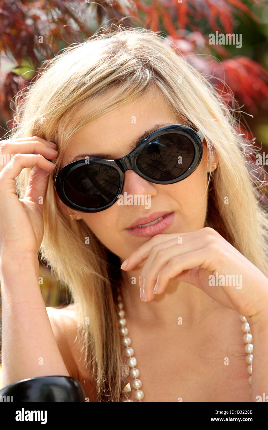 Young Woman Wearing Sunglasses Model Released Stock Photo - Alamy