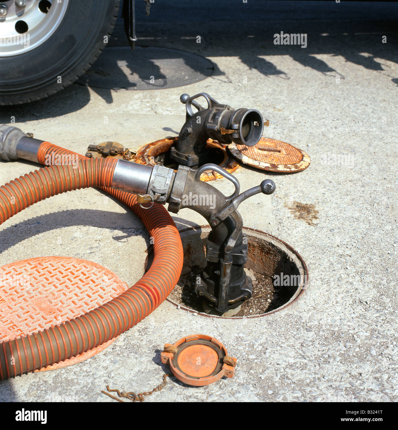 Vapour removal pipe connected to a truck at a petrol gas station sucking vapour from underground fuel tanks in Ontario, Canada  KATHY DEWITT Stock Photo