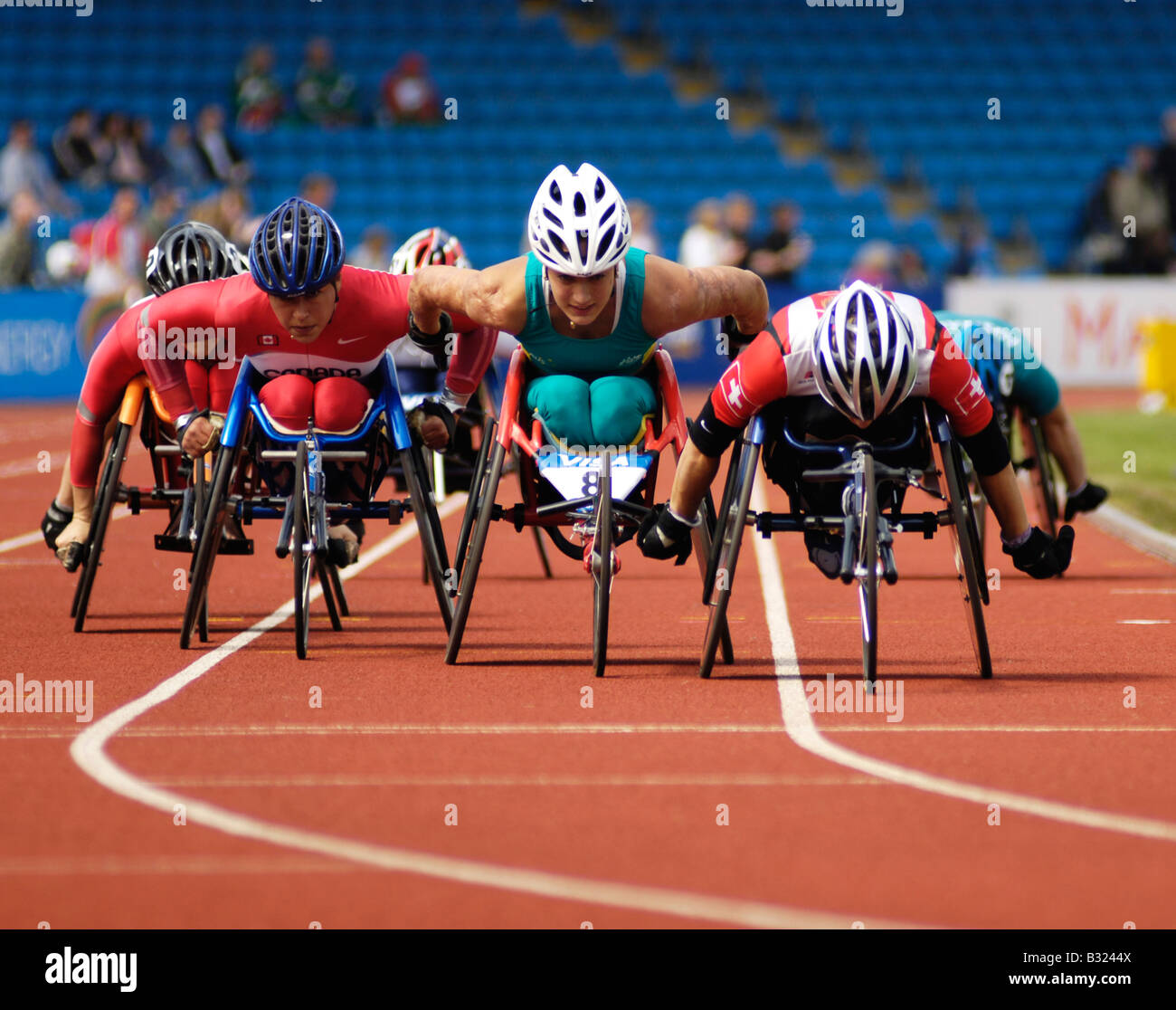 wheelchair athletes raciong at sportcity manchester in paralympics