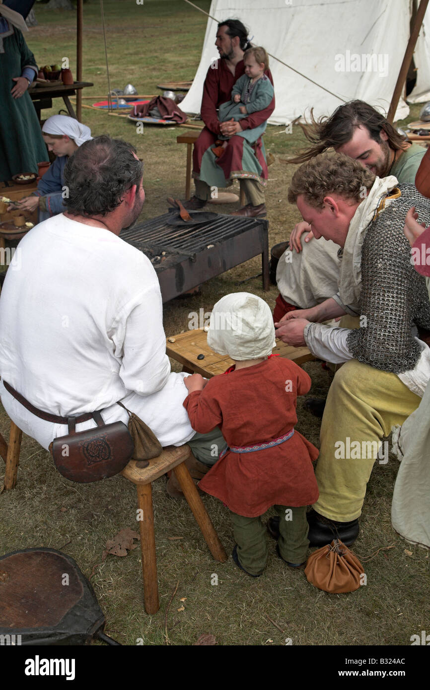 Anglo Saxon family play a board game in their tent Stock Photo