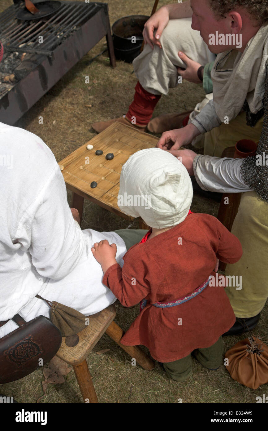 Anglo Saxon family play a board game Stock Photo