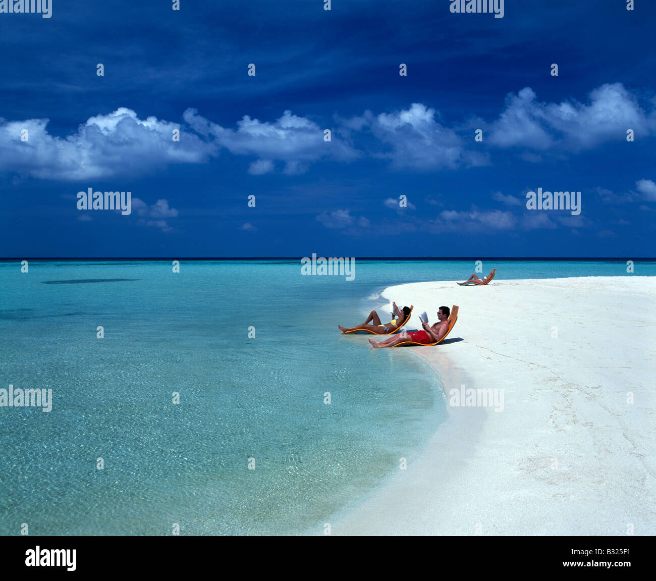 Couple on beach, Maldives Stock Photo