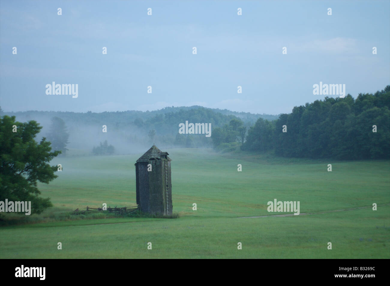 Old wooden grain silo in a misty field near Perth Ontario Canada Stock