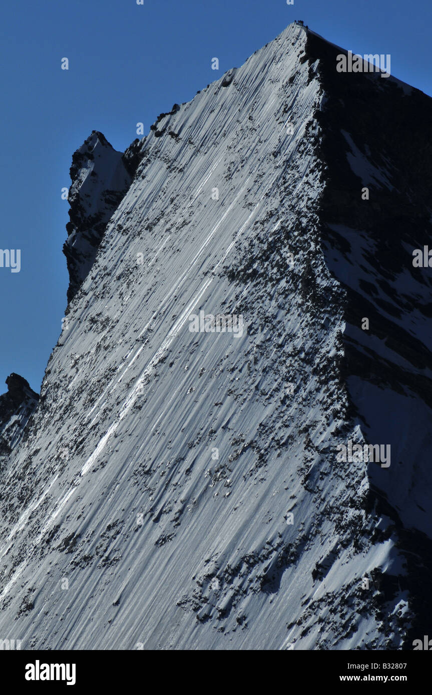 Climbers Summiting on the Dent d'Herens Stock Photo